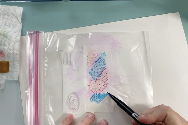 color on a plastic bag to make watercolor art