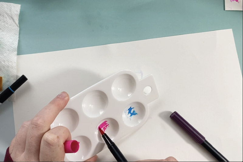 use a plastic palette to color on with markers