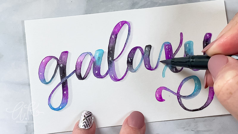 Adding a shadow to the word galaxy with a light gray pen