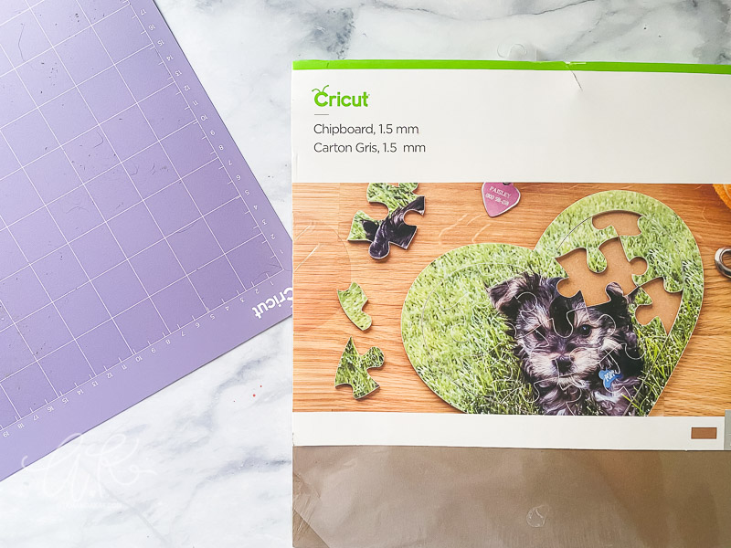 Overhead view of Cricut chipboard material and strong grip mat