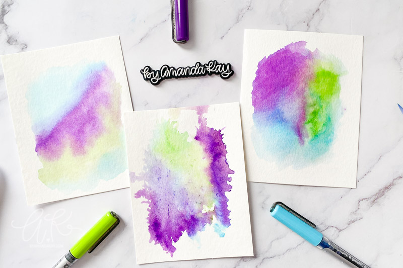 three watercolor backgrounds flat lay